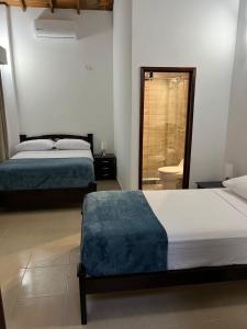 Posteľ alebo postele v izbe v ubytovaní Villa Thiago Finca