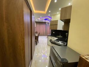 a kitchen with a counter and a dining room at ديزرت بيرل in Hurghada