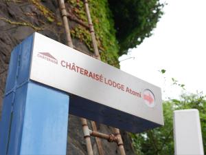 a sign for a chatelaine lodge lodge agent at Chateraise Lodge Atami in Atami +55 photos