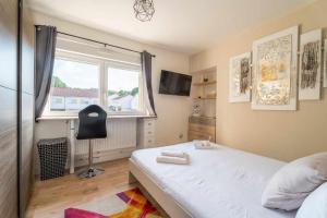 Łóżko lub łóżka w pokoju w obiekcie Le Cosy 120m² - 4 chambres - 8 personnes