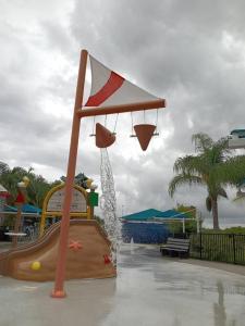 a water park with a basketball hoop on a slide at Elegant Comfort - Newly Updated 3BR with Cozy Master Suite - Pet Friendly in Tarpon Springs