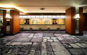 a lobby with a waiting area in a building at Hotel New Otani Tokyo The Main in Tokyo