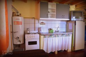 Kuchyň nebo kuchyňský kout v ubytování Cabañas El Retiro, un rincón en la montaña