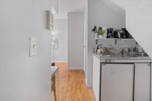 A kitchen or kitchenette at Studio Haven in Times Square & Nearby Restaurants
