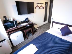 Postelja oz. postelje v sobi nastanitve HOTEL LiVEMAX Tokyo Kanda EAST