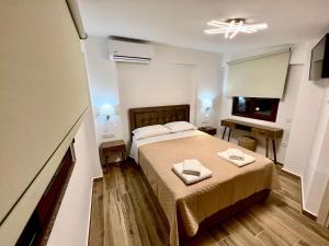 Säng eller sängar i ett rum på Rouga Paradise Resort