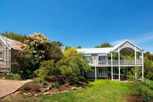 an image of a house with a wrap around porch at Aroona in Daylesford