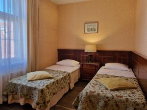 Krevet ili kreveti u jedinici u okviru objekta Taanilinna Hotell