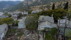 an aerial view of a village with houses and trees at Kastro's View in Kalívia