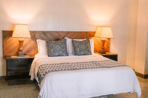 Postel nebo postele na pokoji v ubytování Kaimana Resort Siargao