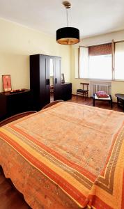 a bedroom with a large bed with a large rug on it at Ti Racconto di un Sogno Rooms - Cielo & Terra in Chianciano Terme