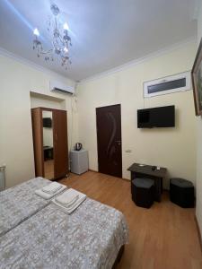 Voodi või voodid majutusasutuse Arm Hotel toas