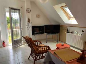 TV a/nebo společenská místnost v ubytování Appartement - Plogoff Pointe du Raz