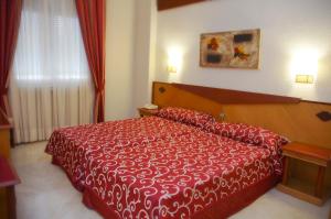 Posteľ alebo postele v izbe v ubytovaní Hotel Del Val