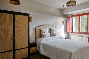 Кровать или кровати в номере El Lagar de Luarca