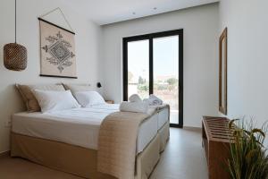 Postel nebo postele na pokoji v ubytování Melior Luxury Villas