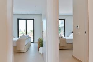 Postel nebo postele na pokoji v ubytování Melior Luxury Villas
