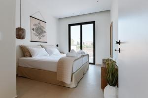 Postel nebo postele na pokoji v ubytování Melior Luxury Villas