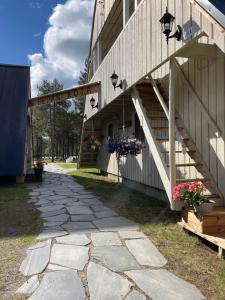 a building with flower boxes on the side of it at Arctic Lodge Hetan Kota in Enontekiö