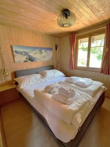 a bedroom with a large bed in a room at Maxima in Fiesch