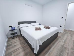 Postel nebo postele na pokoji v ubytování Apartments Avdić