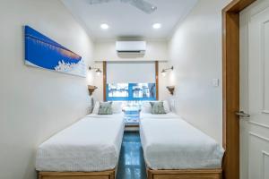 Letto o letti in una camera di Hotel Kemps Corner