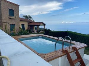 a swimming pool on a patio next to a house at Mie sorelle (tra cielo e mare) in Ventimiglia