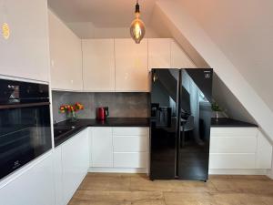 Kuchyňa alebo kuchynka v ubytovaní Apartament Zielone Fotele Starówka + 12 fotografií
