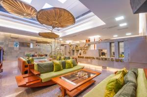 a living room with a couch and a table at Borei Angkor Resort & Spa in Siem Reap