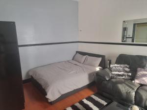 Ένα ή περισσότερα κρεβάτια σε δωμάτιο στο Lackco's kingsize luxurious room