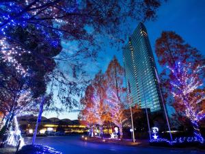 a group of trees decorated with christmas lights at Lake Biwa Otsu Prince Hotel in Otsu
