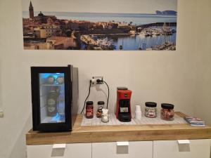 a counter with a drink dispenser on top at Sweetdreams Plaça Civica in Alghero
