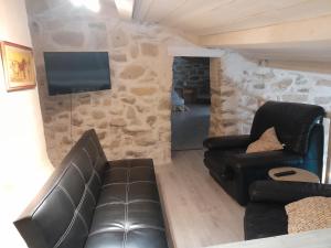 Posezení v ubytování Le Patio Aux Hirondelles