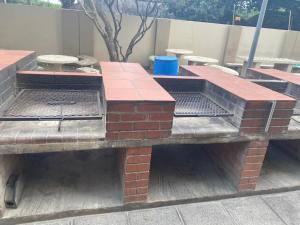 a set of picnic tables on a patio at 146 Stella Maris Durban Amanzimtoti in Amanzimtoti