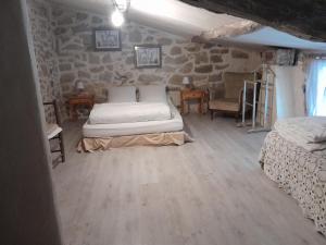 Postel nebo postele na pokoji v ubytování Le Patio Aux Hirondelles