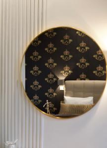 A bed or beds in a room at Minoa Athens Hotel