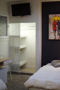 A bed or beds in a room at Minoa Athens Hotel