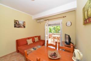 a living room with a couch and a table at Apartments Popovic 2 in Kotor