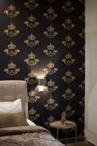 A bed or beds in a room at Minoa Athens Hotel