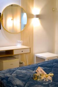 A bed or beds in a room at Minoa Athens Hotel