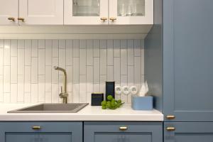 a kitchen counter top with a sink and a counter top at Grand Hotel Residents in Tartu +84 photos