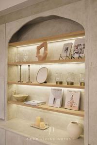 a shelf with a mirror and other items on it at 瀉湖-私人公寓 The Lagoon-Mediterranean vibe vacation house in Kaohsiung