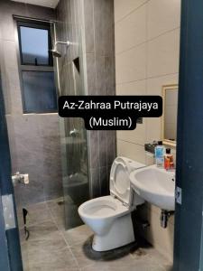 a bathroom with a toilet and a sink at Az-Zahraa Putrajaya - Residences Presint 8 in Putrajaya