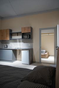 Kuchyň nebo kuchyňský kout v ubytování Boomerang apart-apart hotel + 15 fotografií