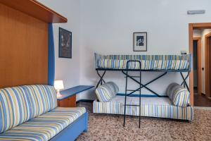 a living room with a bunk bed and a couch at Residenza Adelaide in Finale Ligure