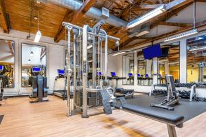 a gym with treadmills and cardio equipment in a building at Kendall Sq 2BR w Gym nr MIT Mass General BOS-665 in Boston