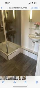 a bathroom with a shower and a sink at 2bed luxury modern apartment in Swansea
