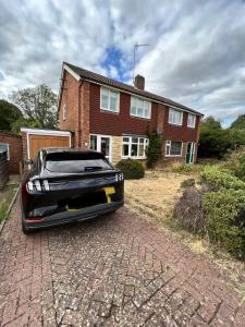a car parked in front of a house at Impeccable 3 bed House in Northampton-perfect for families, contractors, insurance in Northampton