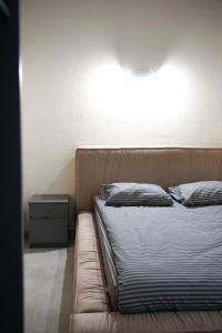 Postel nebo postele na pokoji v ubytování Boomerang apart-apart hotel