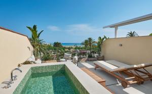 a swimming pool on the roof of a house at Hotel restaurant Ceferino in Vilanova i la Geltrú